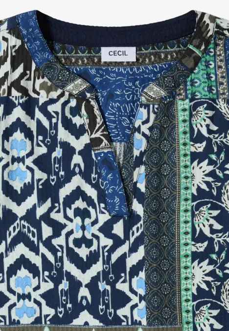 Blau-weiß-grünes Oberteil mit geometrischem und floralem Muster und V-förmigem Ausschnitt, Label "Cecil".