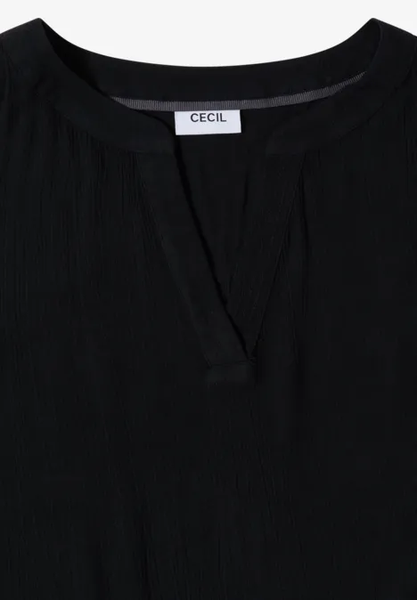 Schwarzes Damenoberteil mit dezentem Schlitz am Rundhalsausschnitt und CECIL-Label.