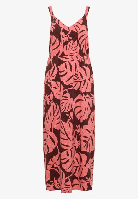 Robe longue sans manches à fines bretelles, motif feuilles tropicales rose sur fond marron.