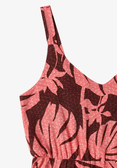 Un top rouge à fines bretelles avec motif de feuilles corail
