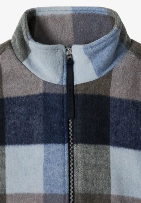 Blouson à col montant et motif à carreaux urban dark blue Veste polaire douce à carreaux bleu et gris, fermeture éclair à l'avant et col montant.