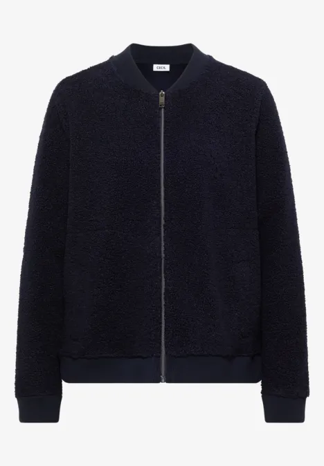 Kurz geschnittene, marineblaue Teddyfleece-Bomberjacke mit Reißverschluss und seitlichen Eingrifftaschen.