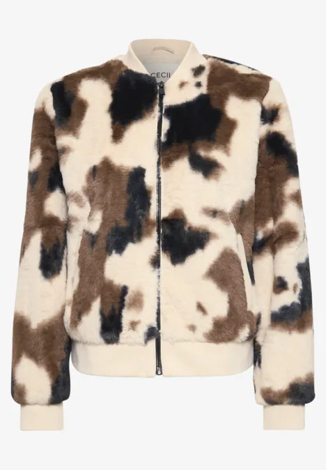 Fake Fur Blouson mit Kuhmuster pearl beige Flauschige Bomberjacke mit braun-weiß-schwarzem Fleckenmuster und Reißverschluss.