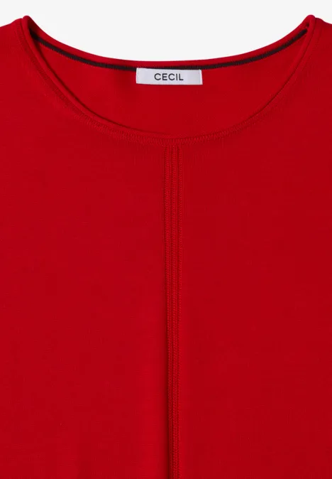 Top rouge pour femme, encolure arrondie, couture centrale apparente et étiquette 'Cecil'.