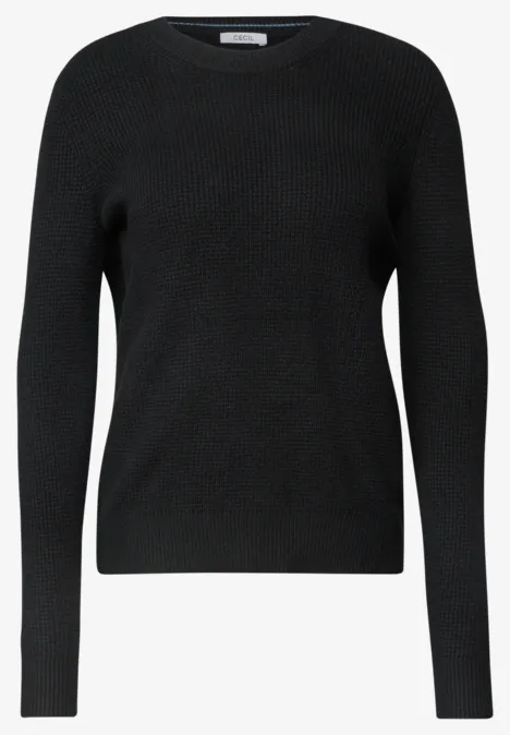 Pull noir simple en maille fine à col rond et manches longues.