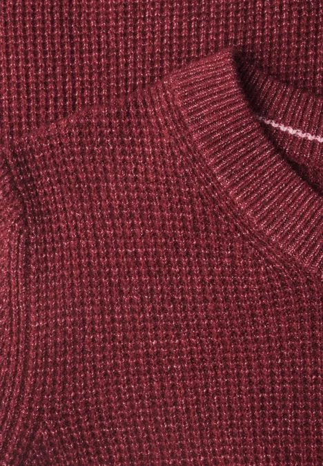 Trui met ronde hals rhubarb melange Nahaufnahme eines rot-melierten Strickpullovers
