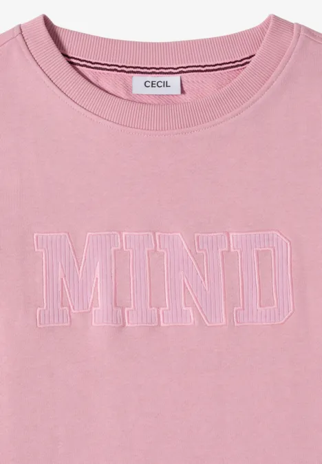 T-shirt rose à col rond avec inscription blanche MIND sur la poitrine.