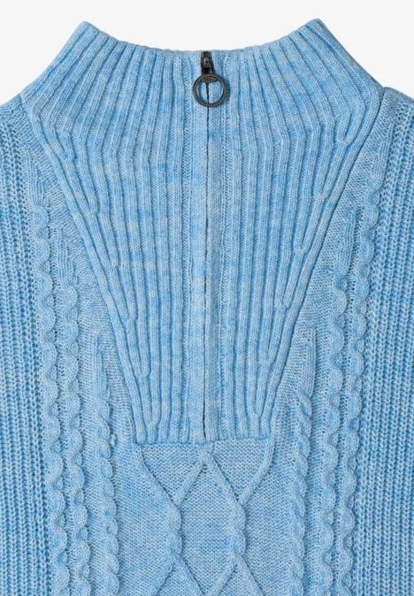 Haut sans manches en maille bleu ciel, col zippé avec anneau et motifs torsadés.