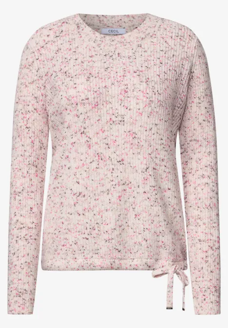Hellrosa Pullover mit bunten Sprenkeln, rundem Ausschnitt und Zierschleife an der Seite.