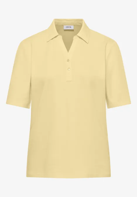 Basic Poloshirt mit Kurzarm buttermilk yellow Helles gelbes Poloshirt mit kurzem Arm und drei Knöpfen am Kragen.