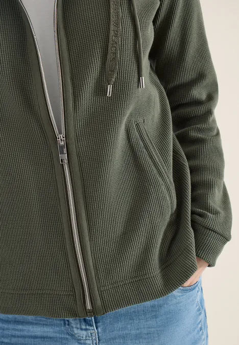 Jas met lange mouwen, capuchon en zakken khaki Jas met lange mouwen, capuchon en zakken khaki