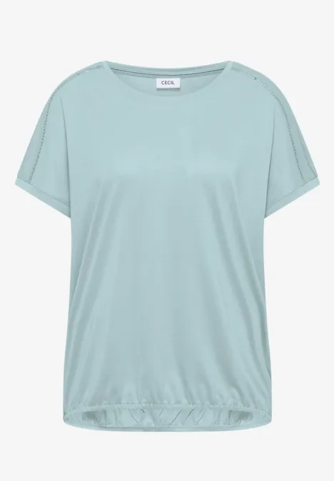 T-shirt ample féminin bleu clair avec manches courtes et ourlet élastique.
