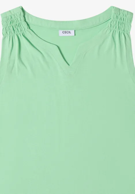Ärmelloses hellgrünes Damenoberteil mit gerafften Schultern und kleinem V-Ausschnitt.