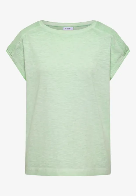 T-shirt ample couleur vert menthe clair, manches tombantes et encolure ronde.