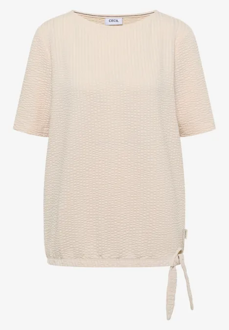 Shirt in seersucker stof pearl beige Beige damestop met korte mouwen, gestructureerde stof en zijtrekkoord onderaan.