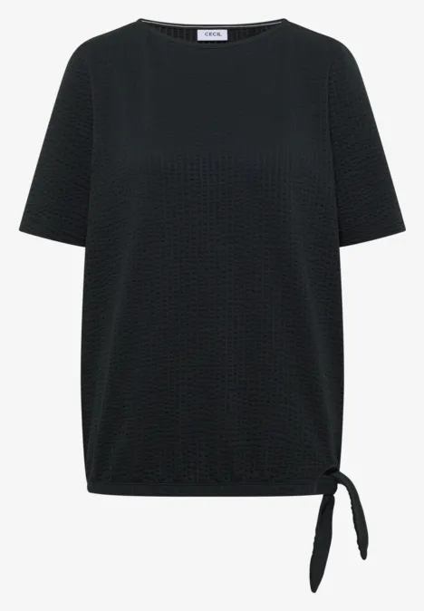 Shirt in seersucker stof palm breeze green Zwart damesshirt met reliëf stippenpatroon, korte mouwen en zijknoopdetail bij de zoom.