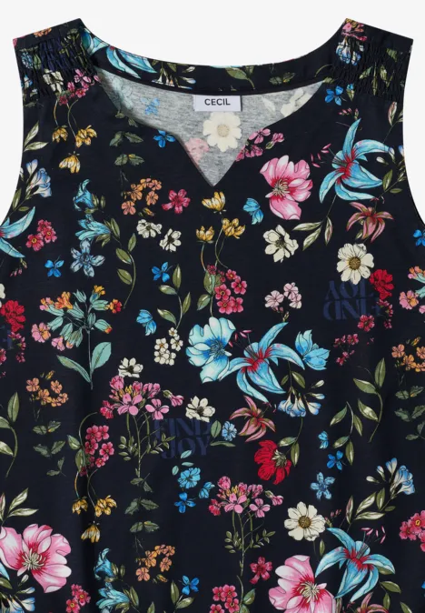 Débardeur femme sans manches à motif floral coloré sur fond sombre.