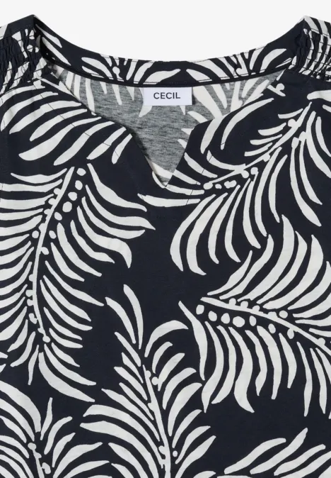 Un T-shirt bleu foncé à imprimé feuilles blanches de la marque CECIL