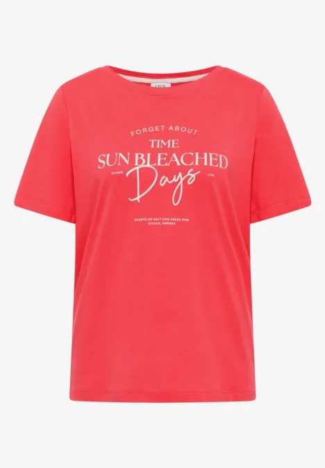 T-shirt rouge court avec inscription blanche 'The sun bleached days'.