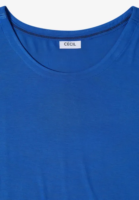 T-shirt à épaules tombantes avec découpe surf blue Un t-shirt bleu uni à col rond avec une petite étiquette portant l’inscription « CECIL ».
