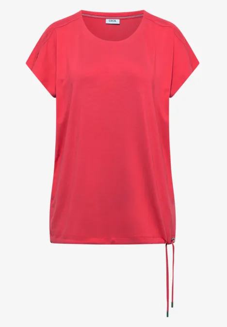 T-shirt à épaules tombantes avec découpe coral T-shirt rouge ample à manches courtes, encolure ronde et cordon latéral au bas du vêtement.