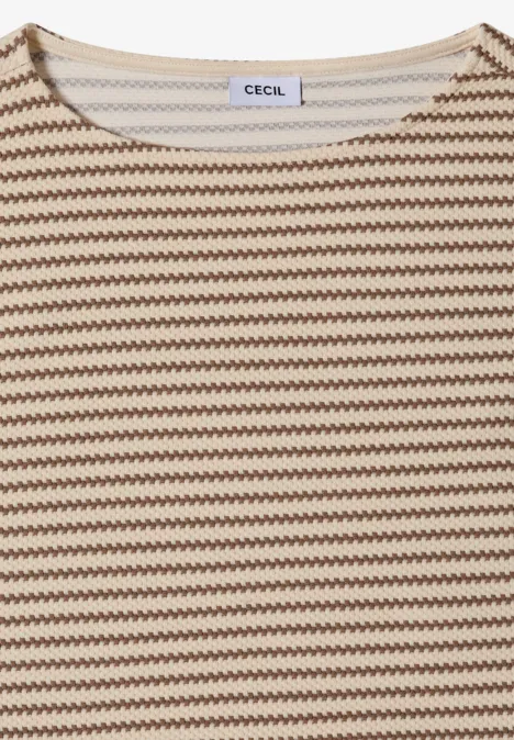 Wit T-shirt met beige en bruine zigzagstrepen, korte mouwen, losse pasvorm.