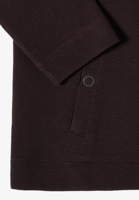 Gilet en tricot marron avec poche latérale et bouton