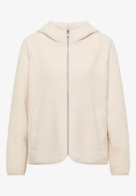 Beige Teddy-Fleece-Jacke mit Kapuze, Reißverschluss und Eingrifftaschen.