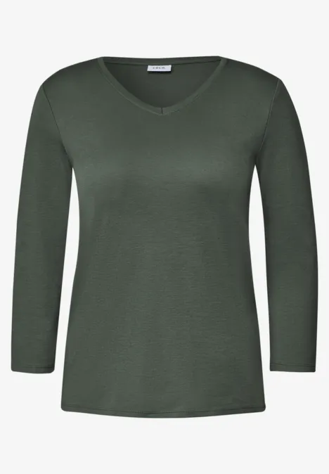 Eenvoudig donkergroen damesshirt met V-hals en lange mouwen.