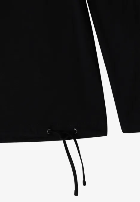 T-shirt noir à manches longues avec ourlet ajustable et cordons noirs.
