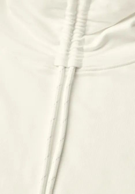 Shirt met lange mouwen, col en trekkoord vanilla white Close-up van een lichtkleurige hoodie met trekkoorden en zachte stof.