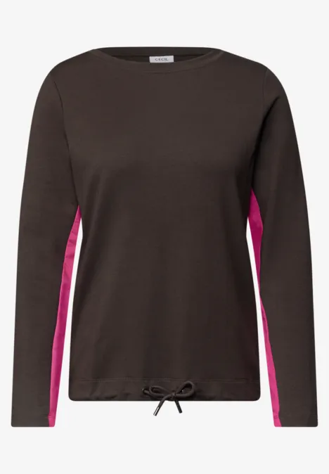 Schwarzes Langarmshirt mit pinken Seiteneinsätzen und Kordelzug am Saum.