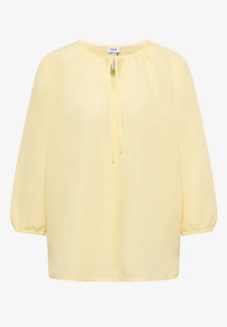 Leichte gelbe Bluse mit 3/4-Ärmeln und gerafftem Rundhalsausschnitt.