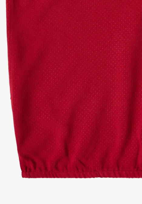 Rotes Mesh-Gewebe mit feiner Netzstruktur und elastischem Saum unten.