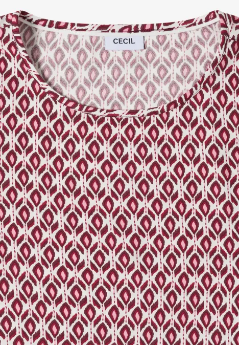 Mouwloos rood topje met wit geometrisch ruitpatroon