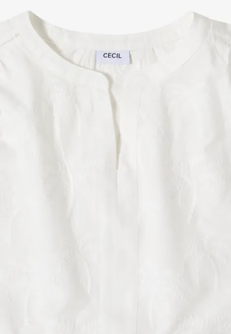 Weißes ärmelloses Oberteil mit Rundhalsausschnitt und feiner Struktur.