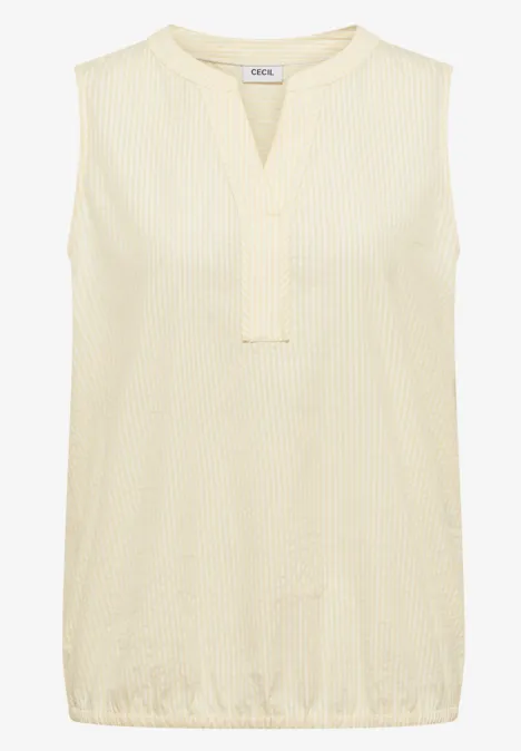 Ärmellose, cremefarbene Bluse mit V-Ausschnitt und feiner Struktur.