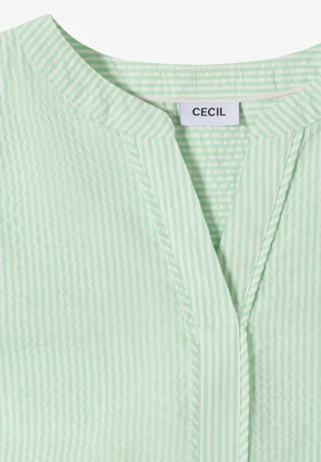Haut femme rayé vert et blanc, encolure en V, étiquette CECIL.