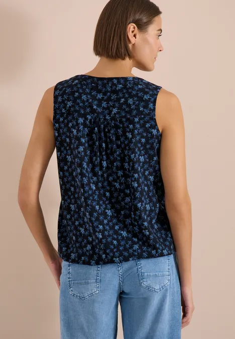 Top sans manches femme bleu foncé à motif floral bleu, coupe décontractée.