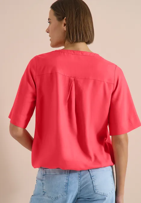 Blouse met korte mouwen en gespleten hals coral Blouse met korte mouwen en gespleten hals coral