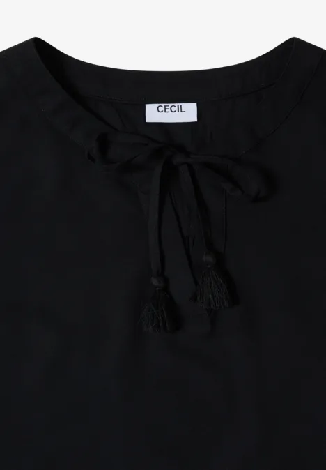 Schwarzes Damenoberteil mit Schnürung und Quasten am Ausschnitt.