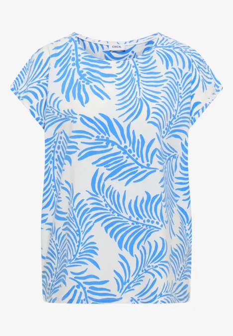 T-shirt blanc ample orné d’un motif de feuilles de palmier bleu clair très visible.