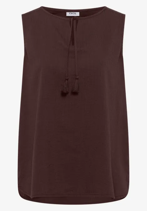 Ärmellose, dunkelbraune Bluse mit V-Ausschnitt und Zierquasten.