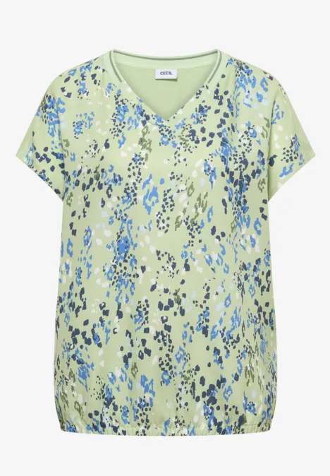 Chemisier à manches courtes avec mélange de textures raw matcha lime Hellgrüne Bluse mit blauem, abstraktem Blumenmuster, V-Ausschnitt, kurzen Ärmeln und elastischem Saum.