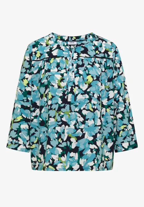 Lockere Damenbluse mit 3/4-Ärmeln und abstraktem Blumenmuster in Blau-, Grün- und Weißtönen.