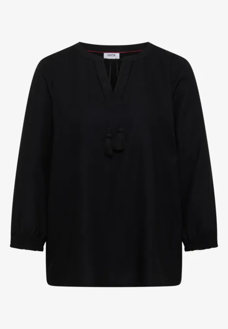 Schlichte schwarze Bluse mit V-Ausschnitt, lockerem Schnitt und lässigen Quasten am Ausschnitt.