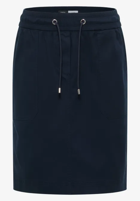 Dunkelblauer knielanger Rock aus Jersey mit elastischem Bund, Tunnelzug und Eingrifftaschen.