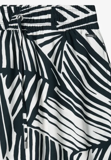 Zwart-witte rok met abstract zebrapatroon en elastische tailleband.