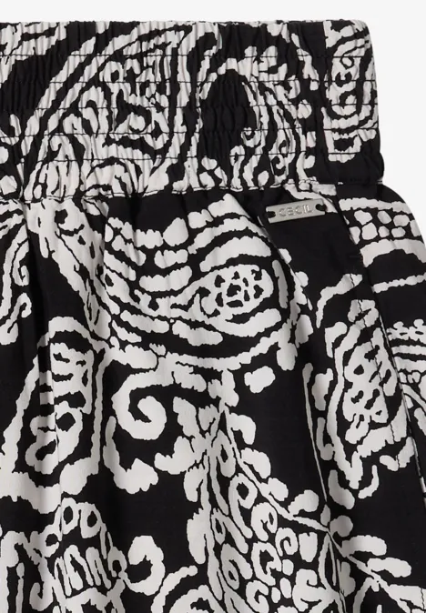 Schwarz-weiß gemusterter Rock mit floralen Paisley-Motiven und elastischem Bund.