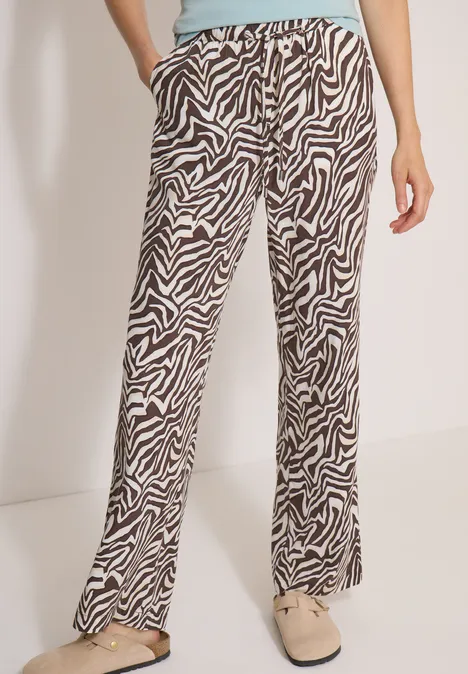 Pantalon Straight Leg avec imprimé zèbre brown cacao Pantalon ample à motif zèbre noir et blanc, taille élastique, coupe décontractée.